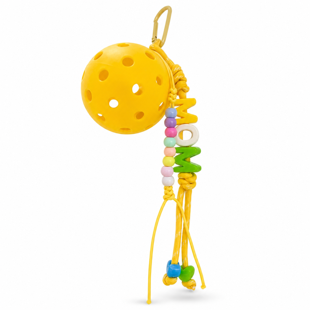 pickleball paddle and ball keychain on white background